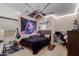 A vibrant bedroom featuring modern decor, carpeted floors and natural light, creating a stylish space at 16178 W Granada Rd, Goodyear, AZ 85395