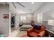 Spacious bedroom with a ceiling fan, an armchair, and sliding closet doors, for ample storage at 16178 W Granada Rd, Goodyear, AZ 85395