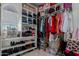Walk-in closet with lots of shelving, racks and storage for clothes and shoes at 16178 W Granada Rd, Goodyear, AZ 85395