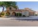 Stunning two-story home featuring a terracotta tile roof, arched entryway and a two car garage at 16178 W Granada Rd, Goodyear, AZ 85395