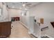 Bright hallway with herringbone tile, desk, natural light and view to office at 16178 W Granada Rd, Goodyear, AZ 85395