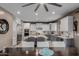 Spacious kitchen with a large island, white cabinetry, stainless steel appliances, and ample counter space at 16178 W Granada Rd, Goodyear, AZ 85395