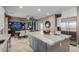Stylish kitchen with an island, stainless steel appliances, and easy access to the living area at 16178 W Granada Rd, Goodyear, AZ 85395