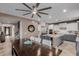 Open-concept kitchen and dining area with a large island, modern appliances, and ample seating at 16178 W Granada Rd, Goodyear, AZ 85395