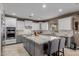 Well-appointed kitchen featuring an island, stainless steel appliances, and sleek cabinetry at 16178 W Granada Rd, Goodyear, AZ 85395
