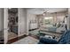 Bedroom featuring wood floors, walk-in closet and ensuite bathroom at 16178 W Granada Rd, Goodyear, AZ 85395