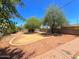 Large backyard featuring desert landscaping, a privacy fence, and a brick patio area at 1629 N 17Th Ave, Phoenix, AZ 85007