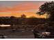 Picturesque backyard view of the water at sunset at 16727 S 178Th Dr, Goodyear, AZ 85338