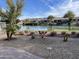 Beautiful backyard view of the lake and nearby houses on a sunny day at 16727 S 178Th Dr, Goodyear, AZ 85338