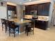 Gourmet kitchen featuring stainless steel appliances, granite countertops, and large island at 16727 S 178Th Dr, Goodyear, AZ 85338