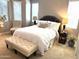 Cozy main bedroom with neutral decor, plush bedding, and bright natural light at 16727 S 178Th Dr, Goodyear, AZ 85338