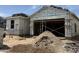 New home under construction with visible framing, sheathing, and building materials on-site at 17082 W Seldon Ln, Waddell, AZ 85355