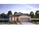 Charming single-story home with stone accents, neutral colors, and a well-manicured front yard at 17082 W Seldon Ln, Waddell, AZ 85355