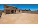 Expansive backyard featuring a covered patio and privacy walls, perfect for outdoor entertaining at 18365 W Villa Hermosa Ln, Surprise, AZ 85387