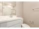 Bathroom featuring white vanity, toilet, and enclosed shower with glass door at 18365 W Villa Hermosa Ln, Surprise, AZ 85387