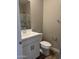 Bathroom featuring a modern vanity, toilet, and shower-tub combo at 18365 W Villa Hermosa Ln, Surprise, AZ 85387