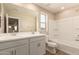 Modern bathroom with dual sinks, vanity, tub and shower combination at 18365 W Villa Hermosa Ln, Surprise, AZ 85387