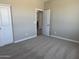 Comfortable carpeted bedroom with a closet, offering a serene retreat at 18365 W Villa Hermosa Ln, Surprise, AZ 85387