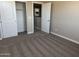 Bedroom with neutral carpet, closet, and an open doorway to the rest of the home at 18365 W Villa Hermosa Ln, Surprise, AZ 85387