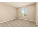Bright bedroom with neutral carpet, a window, and ample natural light at 18365 W Villa Hermosa Ln, Surprise, AZ 85387