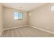 Cozy bedroom featuring neutral carpet, light-colored walls, and natural light at 18365 W Villa Hermosa Ln, Surprise, AZ 85387