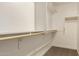 Spacious walk-in closet with shelving and hanging rods for optimal organization at 18365 W Villa Hermosa Ln, Surprise, AZ 85387