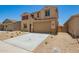 Inviting two-story home with red shutters, desert landscaping, and a two-car garage at 18365 W Villa Hermosa Ln, Surprise, AZ 85387