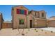 New construction home with two-car garage and low-water landscaping in a desert environment at 18365 W Villa Hermosa Ln, Surprise, AZ 85387