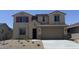Charming two-story home with a well-maintained front yard and two-car garage, offering curb appeal at 18365 W Villa Hermosa Ln, Surprise, AZ 85387