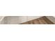 Close-up on neutral-toned tile flooring with a herringbone pattern at 18365 W Villa Hermosa Ln, Surprise, AZ 85387