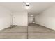 Spacious garage with concrete floor, ample space for vehicles and storage at 18365 W Villa Hermosa Ln, Surprise, AZ 85387