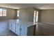 Open-concept kitchen with a quartz-topped island, perfect for meal prep and entertaining at 18365 W Villa Hermosa Ln, Surprise, AZ 85387