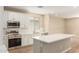 Modern kitchen with white cabinetry, an island, and stainless steel appliances at 18365 W Villa Hermosa Ln, Surprise, AZ 85387