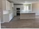 Modern kitchen with white cabinetry, stainless steel appliances, and ample counter space at 18365 W Villa Hermosa Ln, Surprise, AZ 85387