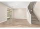 Bright living room boasts wood-look tile floors and sliding glass door access at 18365 W Villa Hermosa Ln, Surprise, AZ 85387