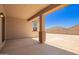 Comfortable covered patio showing the open and spacious backyard on a clear, sunny day at 18365 W Villa Hermosa Ln, Surprise, AZ 85387