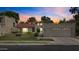 Charming home with a red tile roof, well-maintained lawn, and attached two-car garage at 190 E Tremaine Ave, Gilbert, AZ 85234
