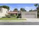 Charming home with a red tile roof, well-maintained lawn, and attached two-car garage at 190 E Tremaine Ave, Gilbert, AZ 85234