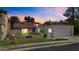 Charming home with a red tile roof, well-maintained lawn, and attached two-car garage at 190 E Tremaine Ave, Gilbert, AZ 85234