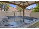 Close-up of a luxurious hot tub under a wooden pergola, perfect for relaxation at 190 E Tremaine Ave, Gilbert, AZ 85234
