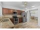 Spacious kitchen offers stainless appliances, granite countertops, and a view into the next room at 190 E Tremaine Ave, Gilbert, AZ 85234