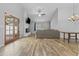 Spacious living room with fireplace, ceiling fan, and beautiful wood-look tile flooring at 190 E Tremaine Ave, Gilbert, AZ 85234
