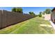 Fully fenced backyard with lush grass and mature landscaping at 2059 E Brown Rd # 35, Mesa, AZ 85213