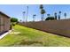 Spacious backyard featuring a well-maintained lawn and a tall fence, perfect for outdoor activities and privacy at 2059 E Brown Rd # 35, Mesa, AZ 85213