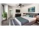 Comfortable bedroom with a modern ceiling fan, neutral colors, and stylish decor accents at 2059 E Brown Rd # 35, Mesa, AZ 85213
