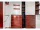 Closet features custom built-in wood cabinetry and shelving at 2059 E Brown Rd # 35, Mesa, AZ 85213