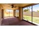 Screened-in patio providing beautiful views of the landscaped backyard at 2059 E Brown Rd # 35, Mesa, AZ 85213