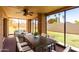 Enclosed patio features a dining table and additional seating, providing a serene outdoor space at 2059 E Brown Rd # 35, Mesa, AZ 85213