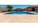 Community pool showcasing sparkling blue water, ample seating, and well-maintained landscaping creating a resort-like atmosphere at 2059 E Brown Rd # 35, Mesa, AZ 85213