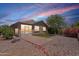 Beautifully landscaped backyard with patio and lush greenery at 22993 W Micah Way, Buckeye, AZ 85326